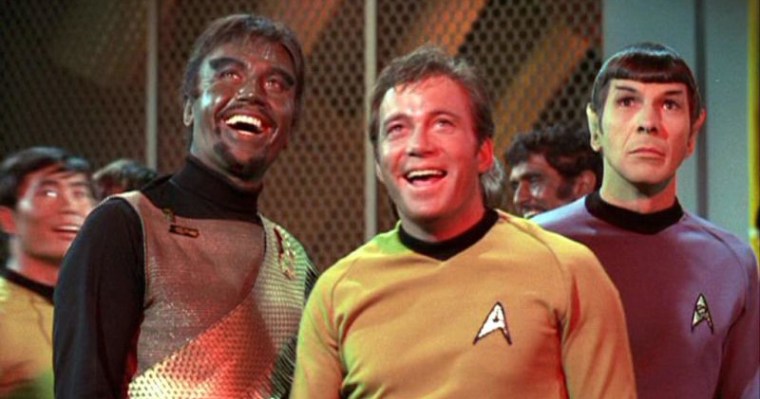 I googled 'Star Trek' for this one too. I'm concerned that the lad on the left is in blackface. Hopefully it all makes sense and he's had an accident with some spaceship exhaust oil or something