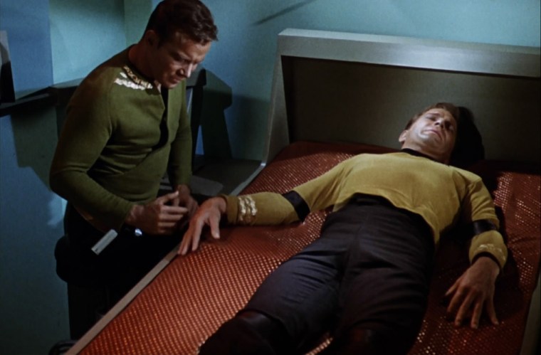 And in an ironic turn of justice, it's the attempted sex offender who ends up being pinned down himself. Hooray! Um, expect he ends up becoming a part of Kirk so he's still sort of on the ship